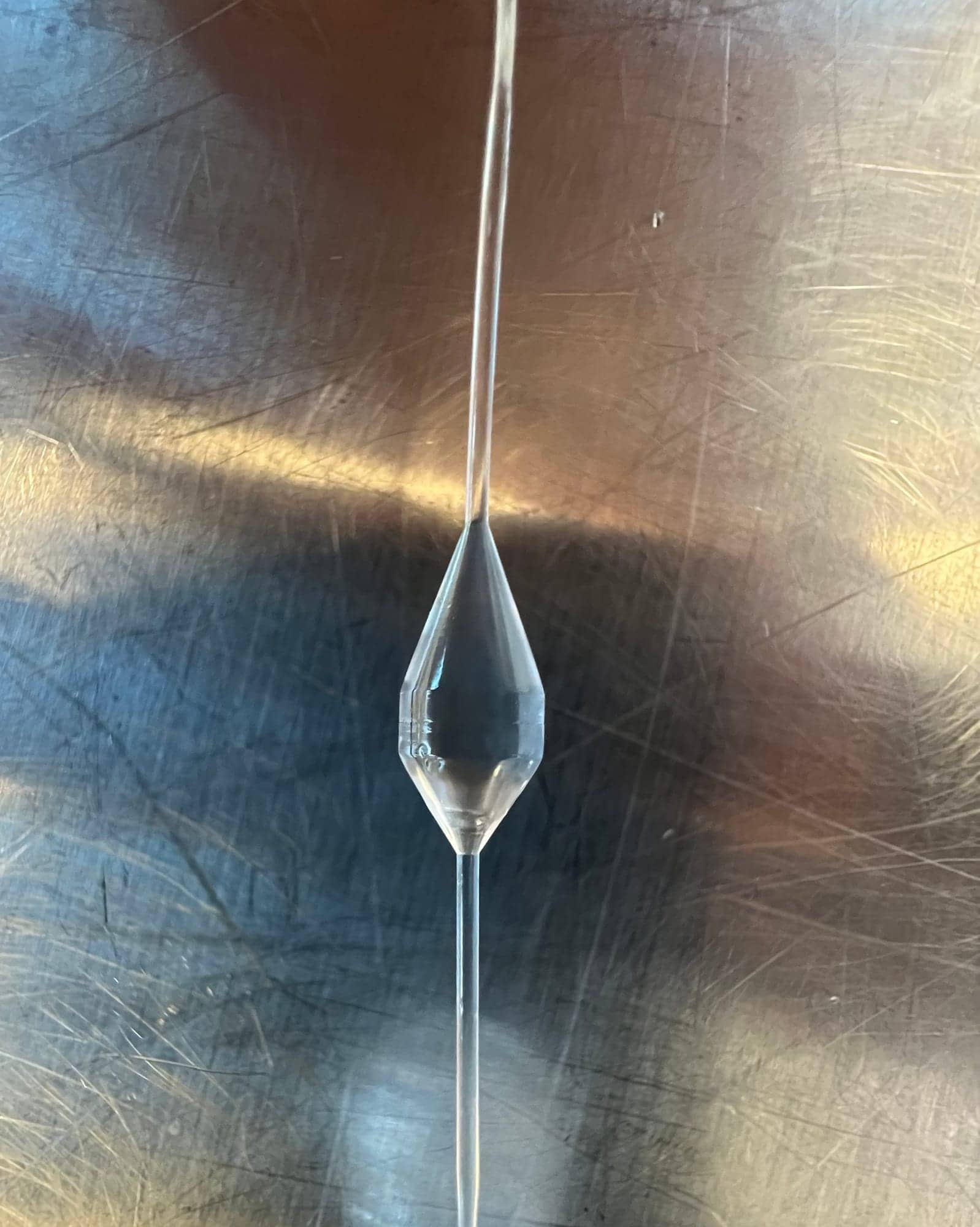 YouStay prototype balloon inflated on its catheter, photographed upright